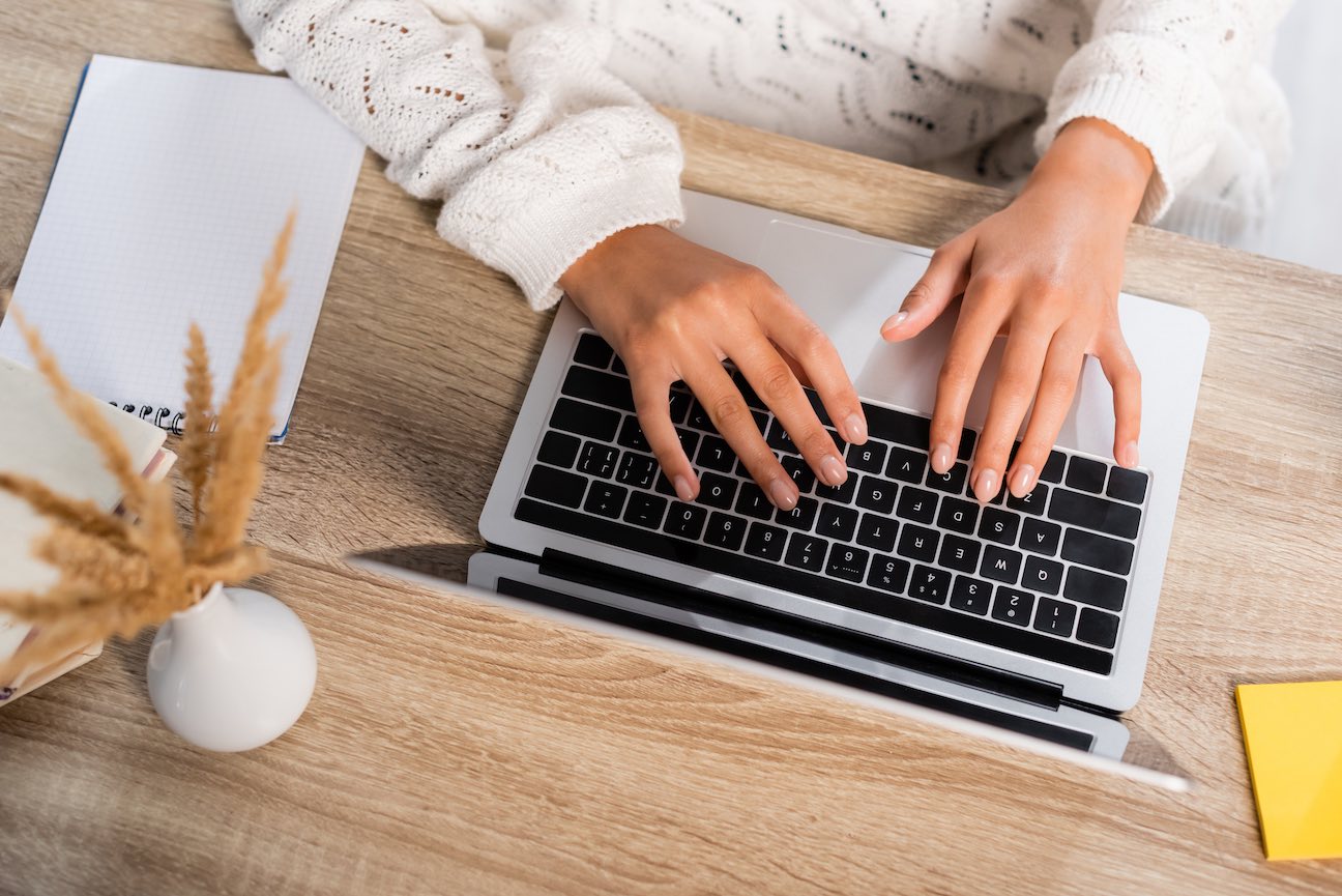 Person Typing on keyboard